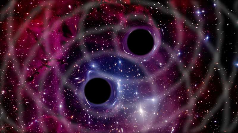 A simulation of gravitational waves generated by a binary black hole system. Image credit, iStock.com/gmutlu.