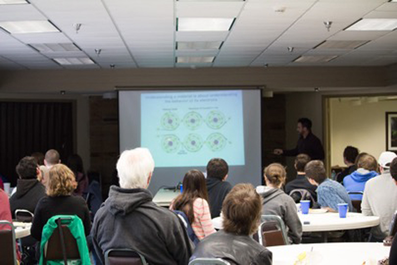 Students listen to Dr. Steven Johnston (UTK) speak about his work in condensed matter.