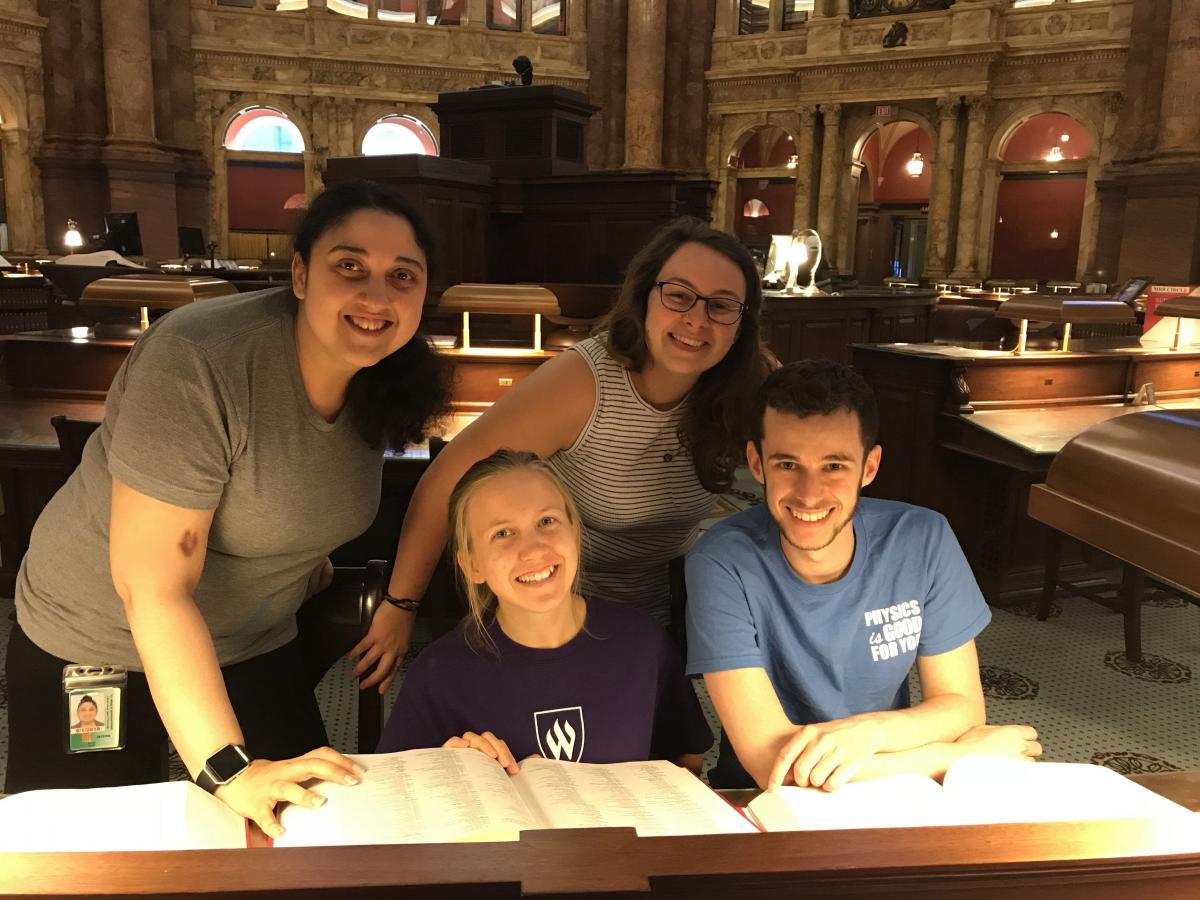 Sarah Monk, Amanda Williams, Mikayla Cleaver, and Nathan Foster checking out some reference books at the Library of Congress.