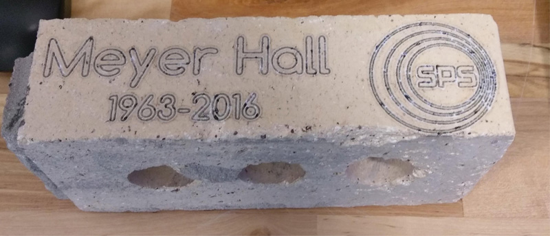 An engraved brick from Meyer Hall. Photo by Lindsey Hart