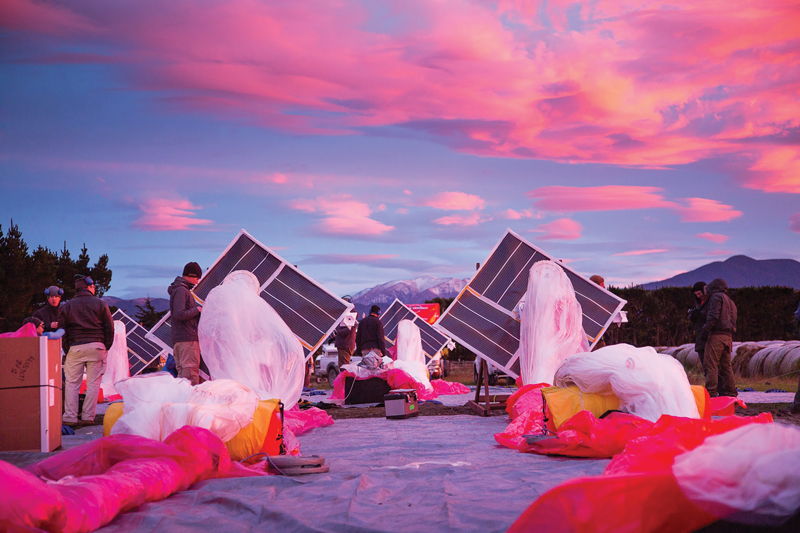 The Project Loon team prepares solar panels, electronics, and balloon envelopes for launch as the sun rises in New Zealand. Photo courtesy of Project Loon / X