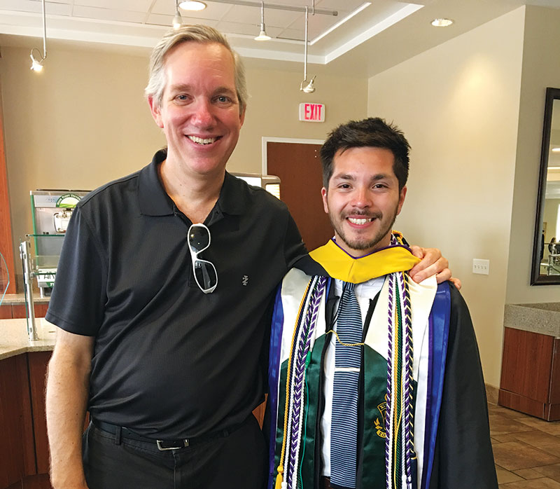 High Point University physics department chair Dr. Aaron Titus sending off last year’s SPS president, Alan Vasquez. Photo courtesy of the HPU Department of Physics.
