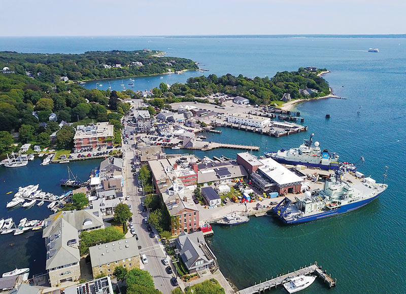 WHOI’s blue-hulled research vessels can be seen  on the right. Photo courtesy of the Woods Hole Oceanographic Institution.
