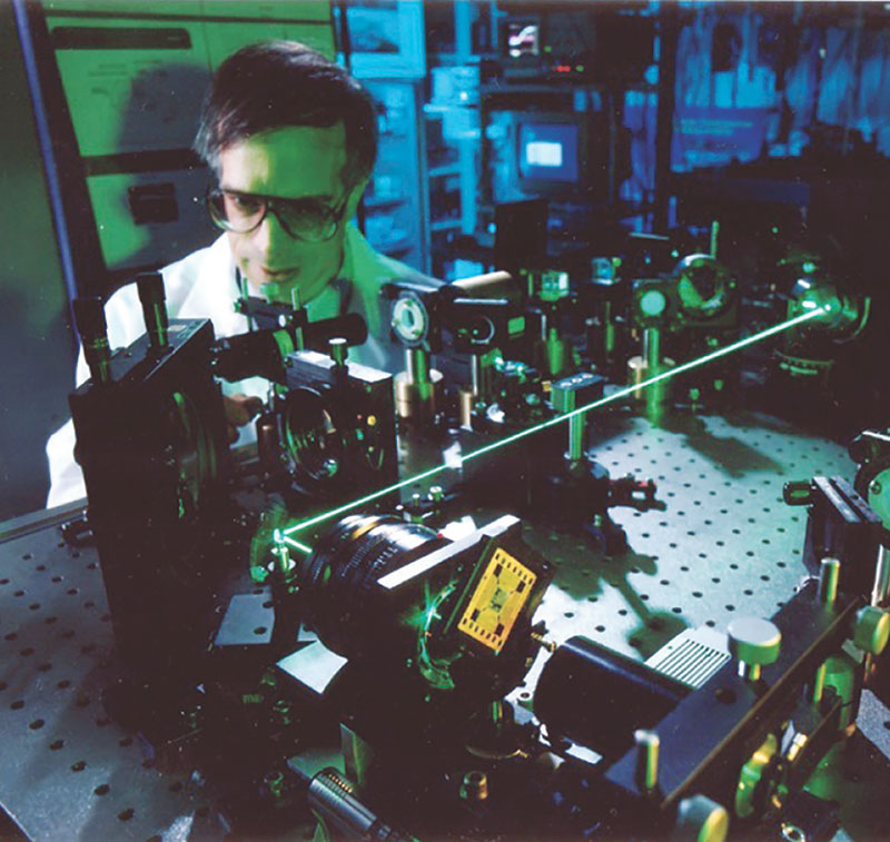 David Pepper performs laser-based ultrasound experiments during his time at HRL (formerly Hughes Research Laboratories). Photo courtesy of Pepper.