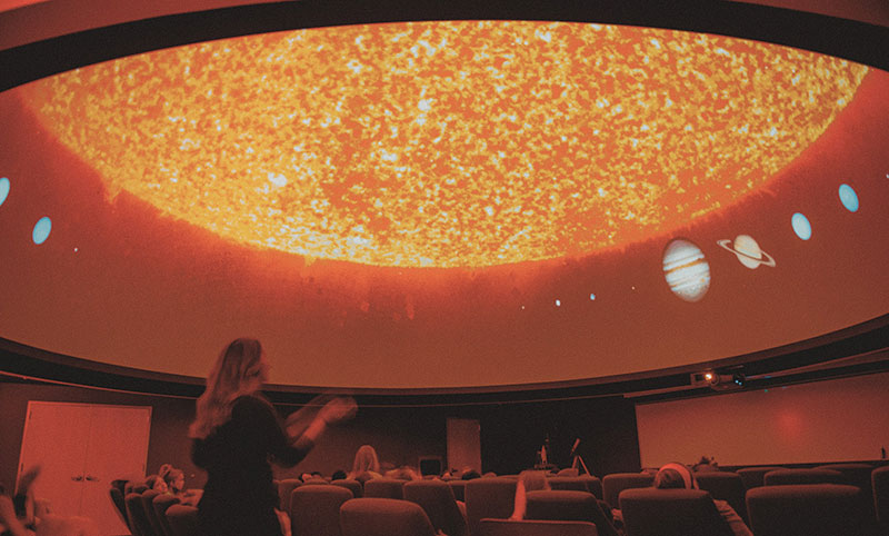 Balliet speaks with students during a planetarium presentation. Photo by Max Wilhelm, Lycoming College institutional videographer and photographer.