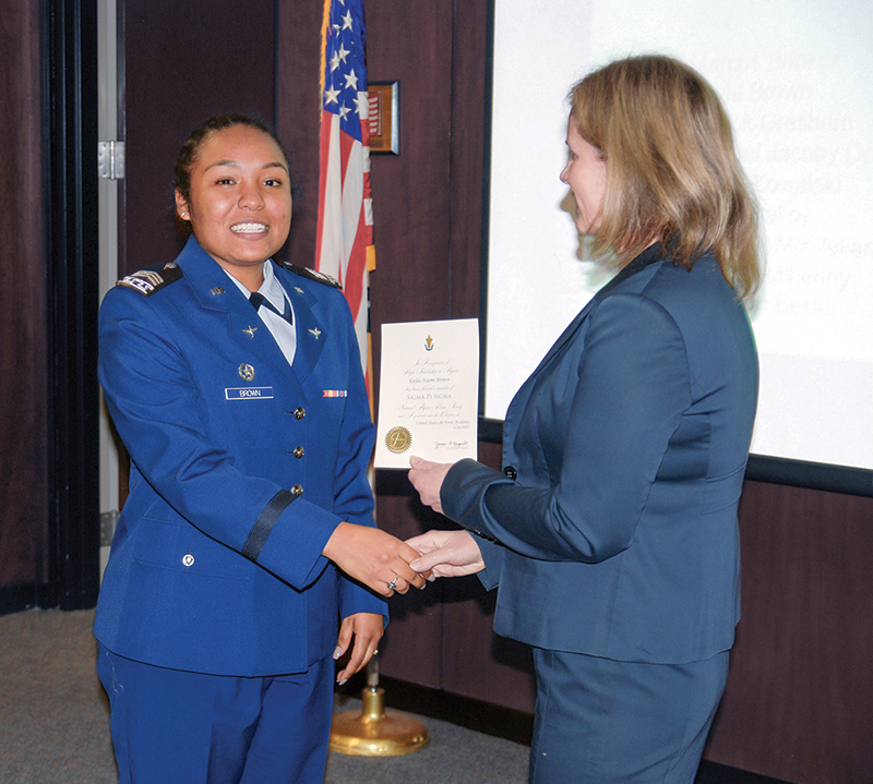 Cadet Second Class Kayla Brown receives her certificate. 