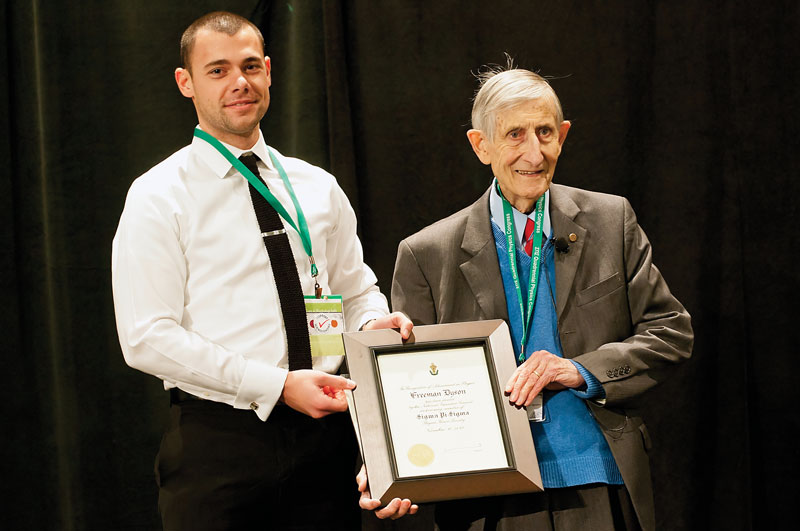 SPS Zone 9 Associate Zone Councilor Brandon Clary (left) inducts Freeman Dyson (right) as an honorary member of Sigma Pi Sigma.