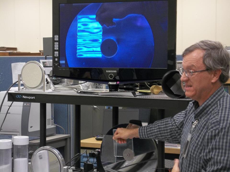 NASA's Bob Youngquist demos a device for detecting leaks. 