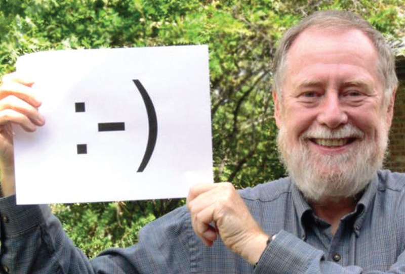 See the resemblance? Scott Fahlman poses with the emoticon he invented. Photo courtesy of Scott Fahlman.