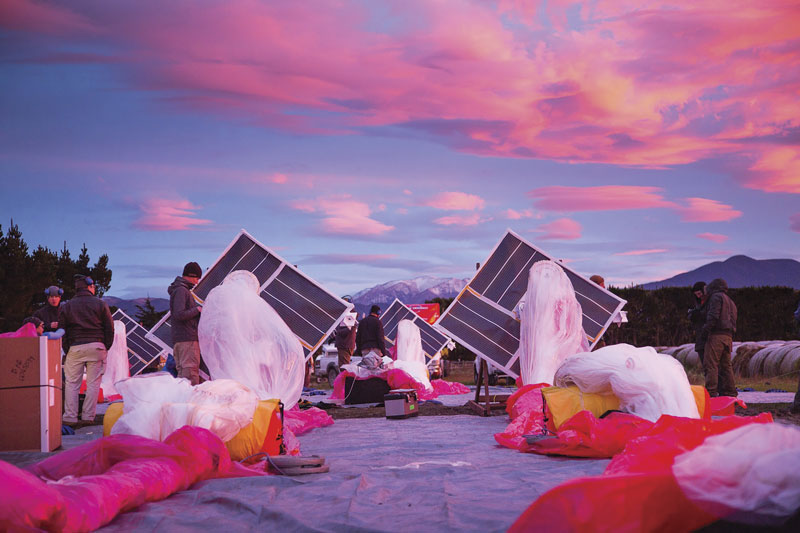 The Project Loon team prepares solar panels, electronics, and balloon envelopes for launch as the sun rises in New Zealand. Photo courtesy of Project Loon / X.