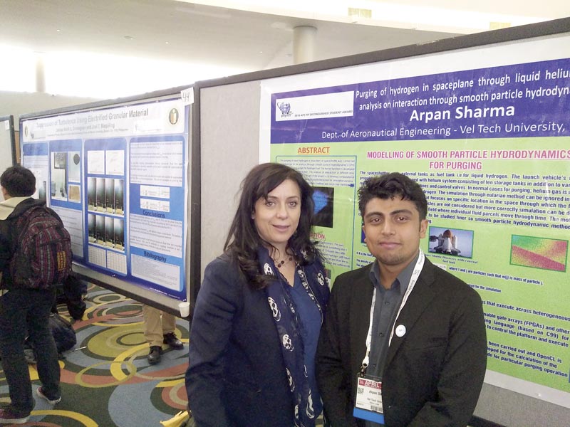 Arpan Sharma is pictured by his poster with Maria Spiropulu, chairman of the APS Forum of International Physics.Photos courtesy of Arpan Sharma.