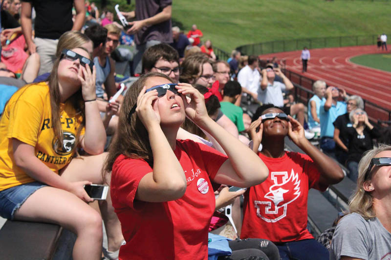 William Jewell College students gaze up at the partial eclipse. Photo by Hannah Wilson.