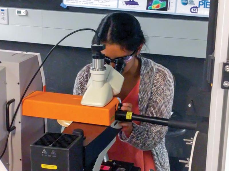 Vanessa Espinoza using the spectrometer. Photo courtesy Vanessa Espinoza.