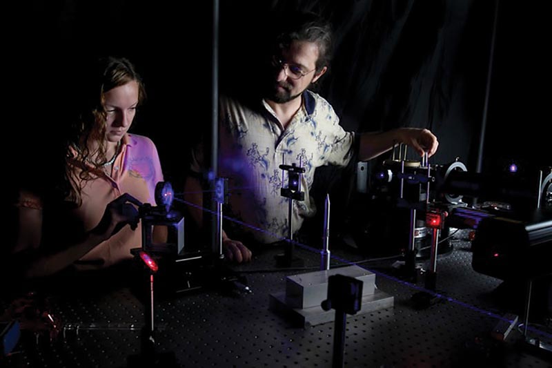 Dr. Kiril Streletzky and SPS Member, Karen Johnson, align a laser beam at Cleveland State University’s Light Scattering Spectroscopy Lab. Photo courtesy Dr. Kiril Streletzky.
