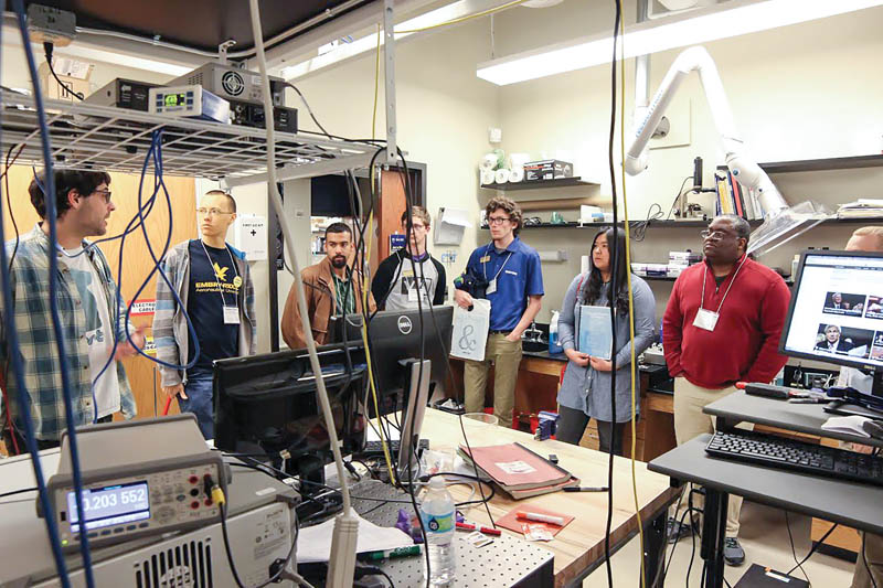 Zone 6 attendees on a lab tour. Courtesy of the Emory University SPS chapter.