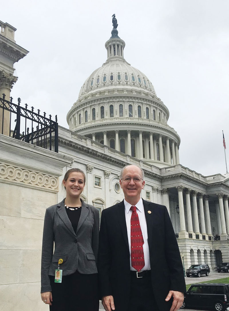 Eleanor stands with Representative Dr. Bill Foster (IL) in front of the Capitol. Rep. Foster is the only physicist in Congress. Photo by Riley Troyer.