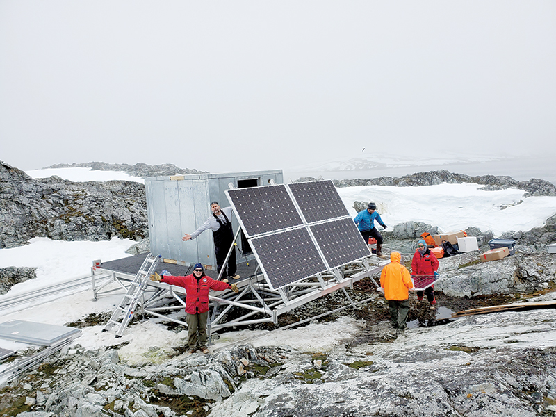 A team installing a high-frequency radar on the Joubin Islands. There are three of these radars installed in a triangle over Palmer Deep. They use backscattering radio waves to map surface currents.