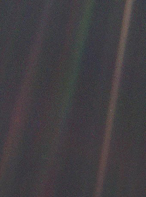 This image of Earth is one of 60 frames taken by the Voyager 1 spacecraft on February 14, 1990, from a distance of more than 6 billion kilometers (4 billion miles) and about 32 degrees above the ecliptic plane. In the image the Earth is a mere point of light, a crescent only 0.12 pixel in size. Our planet was caught in the center of one of the scattered light rays resulting from taking the image so close to the Sun. This image is part of Voyager 1’s final photographic assignment, which captured family portraits of the Sun and planets. Photos courtesy of NASA.
