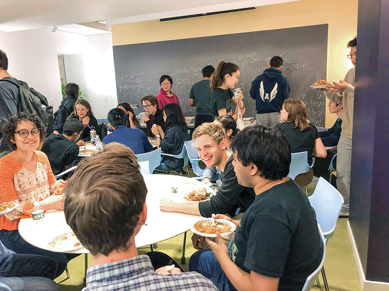 Harvard University SPS students take a study break to enjoy delicious food, meet fellow physics students, chat, and bond over a reading of satirical scientific papers.