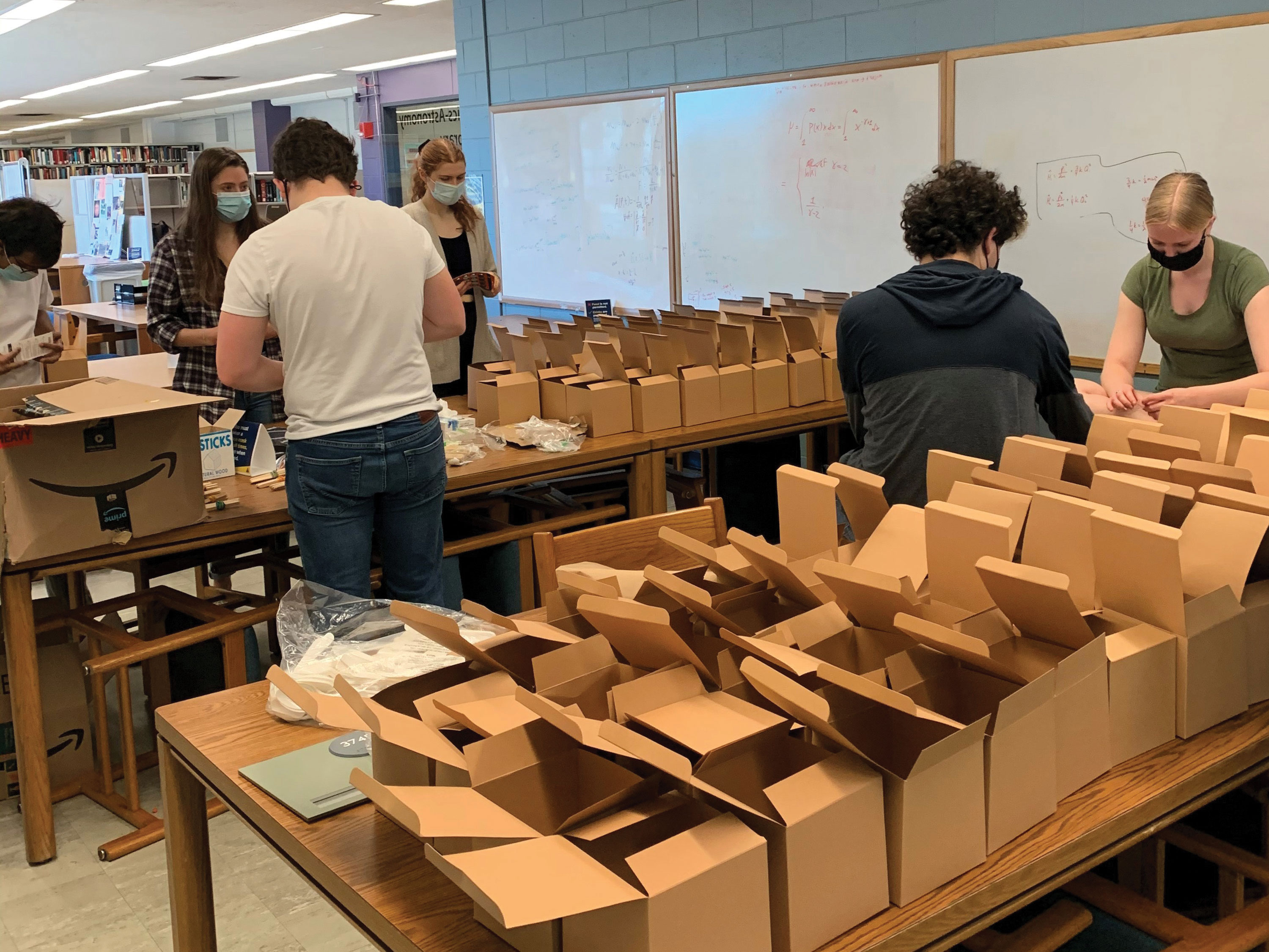 University of Rochester SPS members pack the DIY demonstration boxes. Images courtesy of the chapter