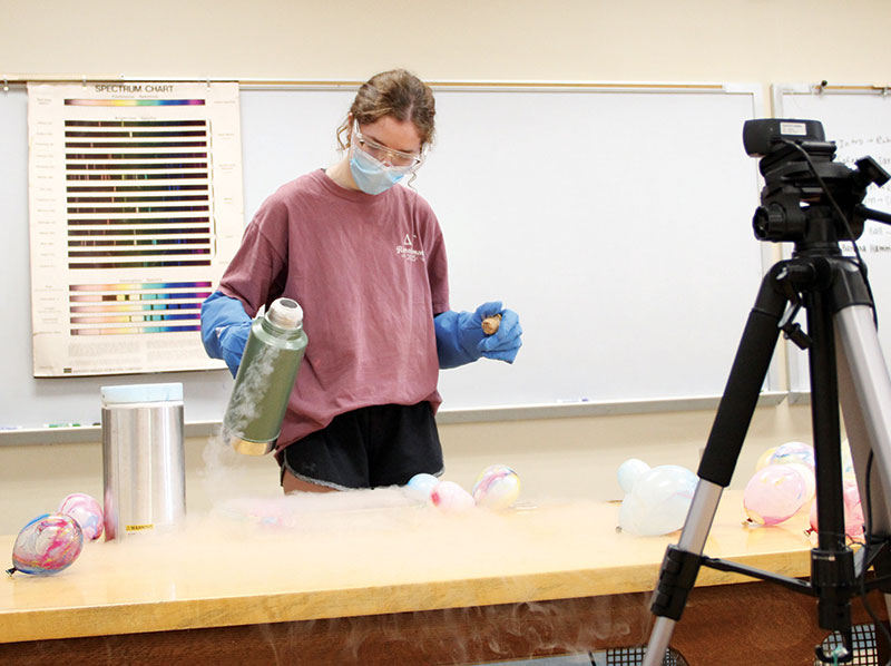 Denison University’s SPS chapter secretary, Jaelyn Roth, performs a liquid nitrogen demonstration during an outreach event held over Zoom. 