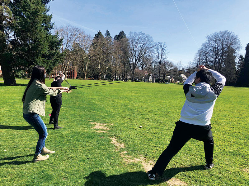 Members of the Reed College SPS chapter during a socially distanced egg-launching competition that made good use of the department slingshot.  