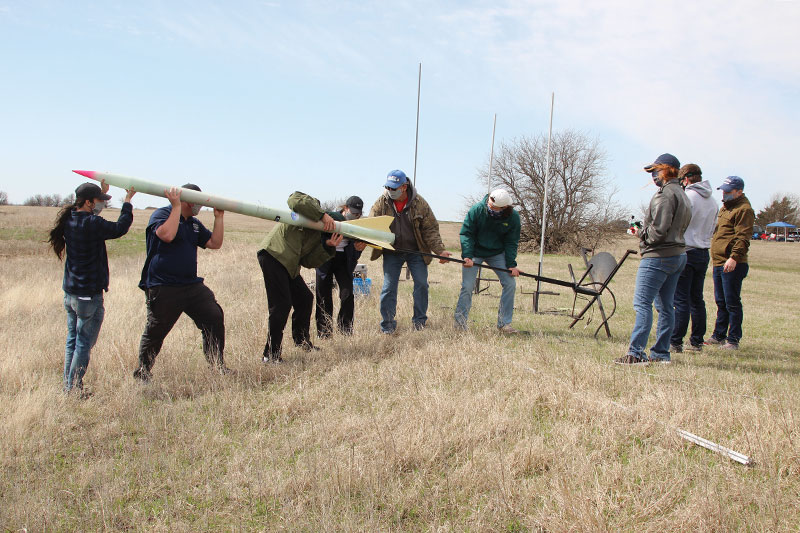 The Southwestern Oklahoma State University Physics Club prepares a rocket for launch in the Argonia Cup Rocketry Competition in Argonia, Kansas, in March 2021. The club earned second place.