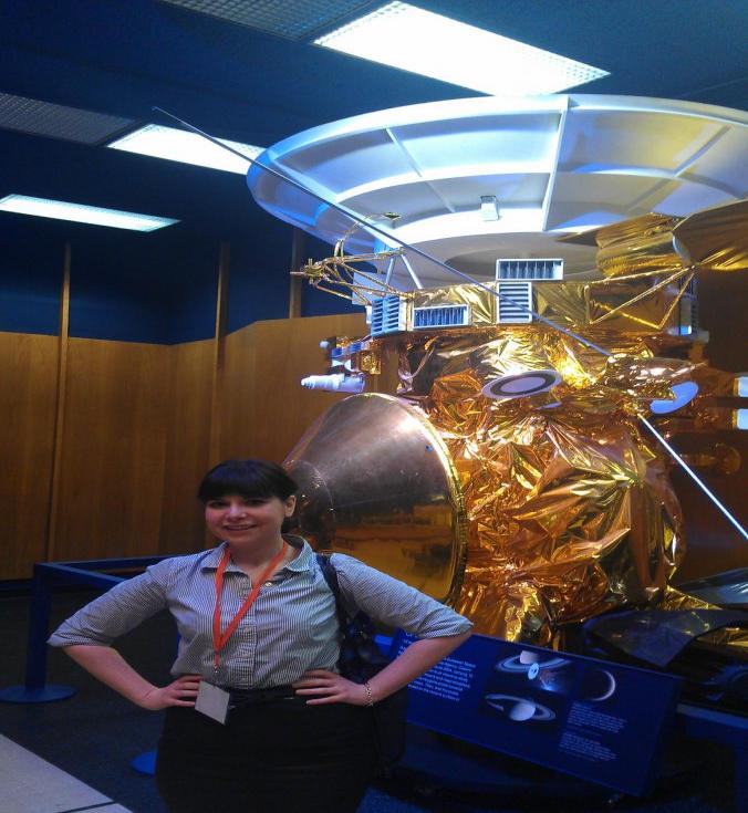 SPS Reporter Angelica Gheen with a model of the Cassini at JPL. Photo courtesy of Angelica Gheen