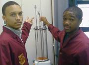 Jeremiah F. Wilson (left) and Lamont Henderson (right),  constructing a photocatalytic reduction chamber for the generation of hydrocarbon from water-saturated carbon dioxide. 
