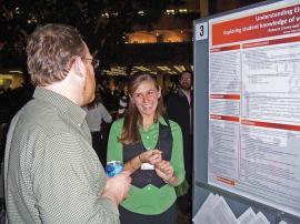 Rebecca Crema describes her research at the 2008 PhysCon at Fermilab. Photo by author.