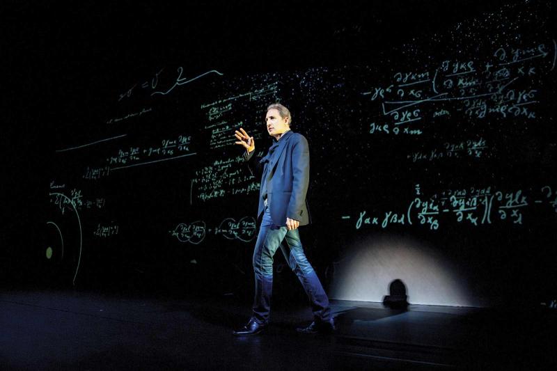 Brian Greene onstage in &quot;Light Falls—Space, Time, and an Obsession of Einstein.&quot; Photo courtesy of the World Science Festival.