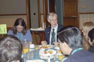 Plenary Speaker and Physics Nobel Laureate John Mather (center) visits with students over breakfast at PhysCon 2012.