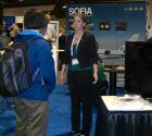 SPS Reporter Jill Pestana discusses the SOFIA Program with an astronomy student at the SOFIA display.
