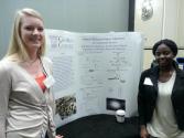 Monica Pescitelli and Rujeko Chinomona of Georgia College showcase their research during the poster session.