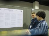 Students sharing their research at a poster session. Photo by Ashley Tucker.