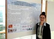 Reporter Kayla Mendel with her research poster at the CUWiP poster session.