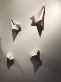 Artistic representation of migration data from research on the Hofstadter butterfly. The origami pieces are pulled apart to represent the increasing disorder in the system. Line segments from disorder graphs are sewn into each triangular piece. All images courtesy of Erin Brady.