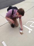 Using my AIP badge to recuse a moth we almost stepped on outside the American Center for Physics