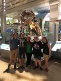 Just some nerds in front of amazing prehistoric fossils.