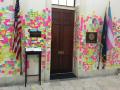 Alexandria Ocasio-Cortez- the only congressperson (that I know of) whose outer wall is covered in post-it notes.