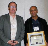 David Donnelly (l) presents Ajay Narayanan with the 2012 Outstanding Chapter Advisor Award